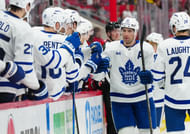 Toronto Maple Leafs players celebrate a goal during an NHL game. (Credits: IMAGN)